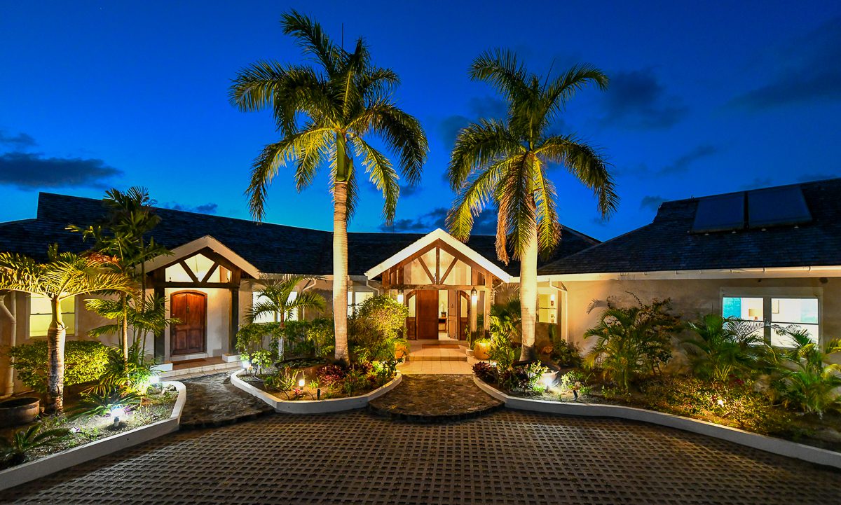 The entrance to Bluff House Estate in Antigua at twilight